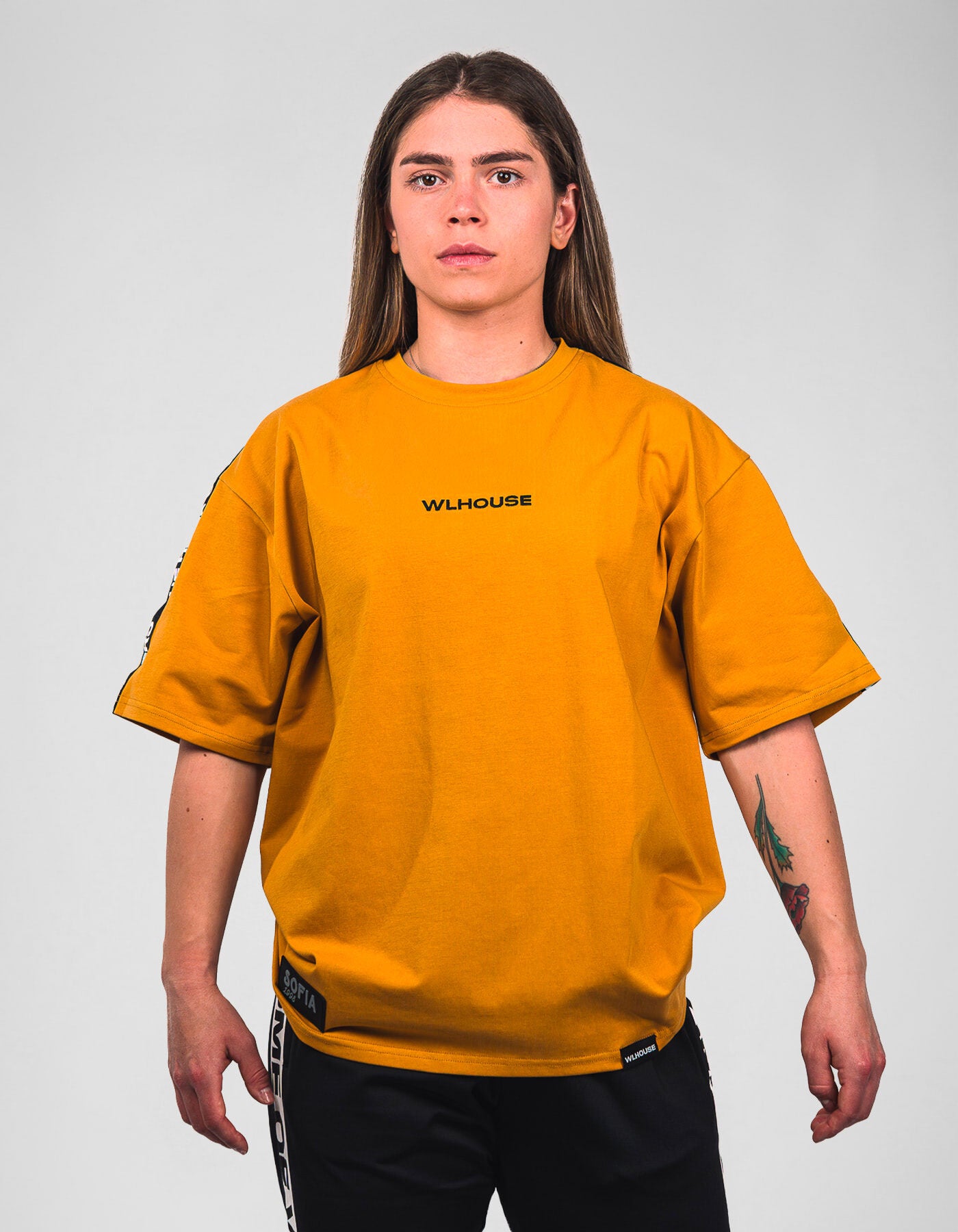 woman in yellow Sofia t-shirt